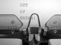 A typing machine typing OUT OF ORDER